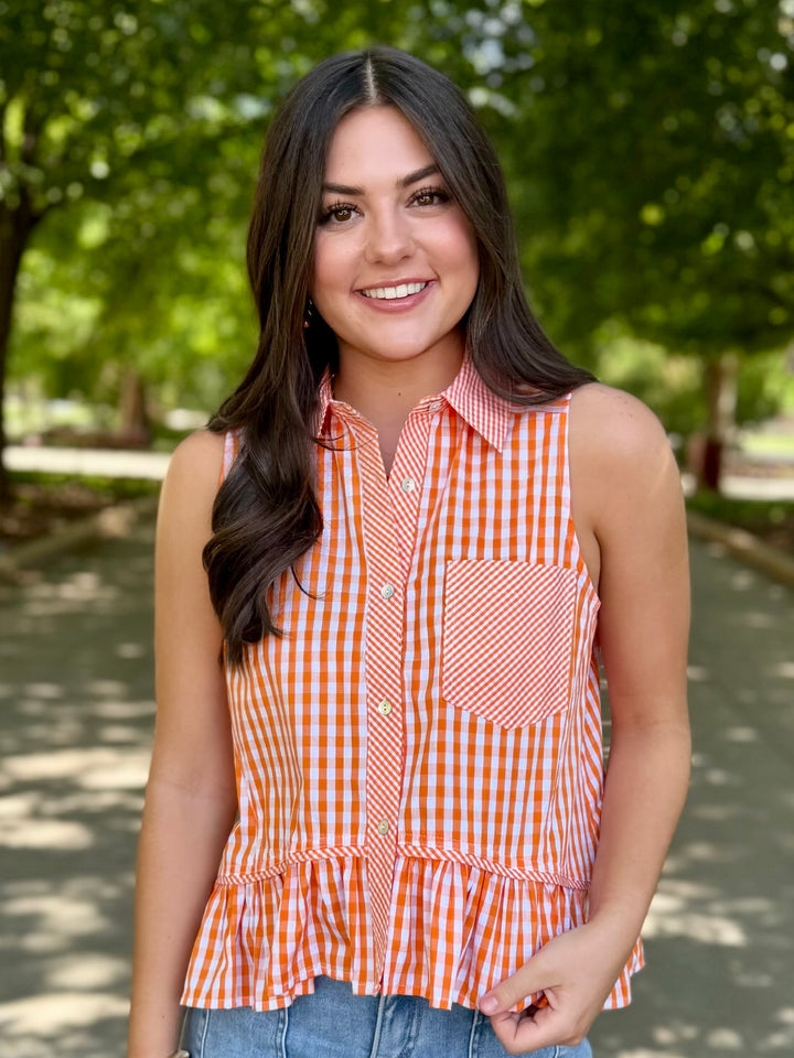 Fourth Quarter Check Orange Peplum Top